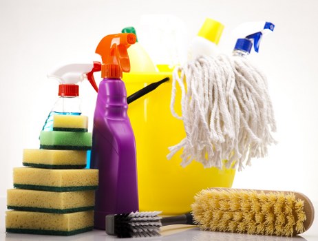 Professional upholstery cleaning equipment used on a couch